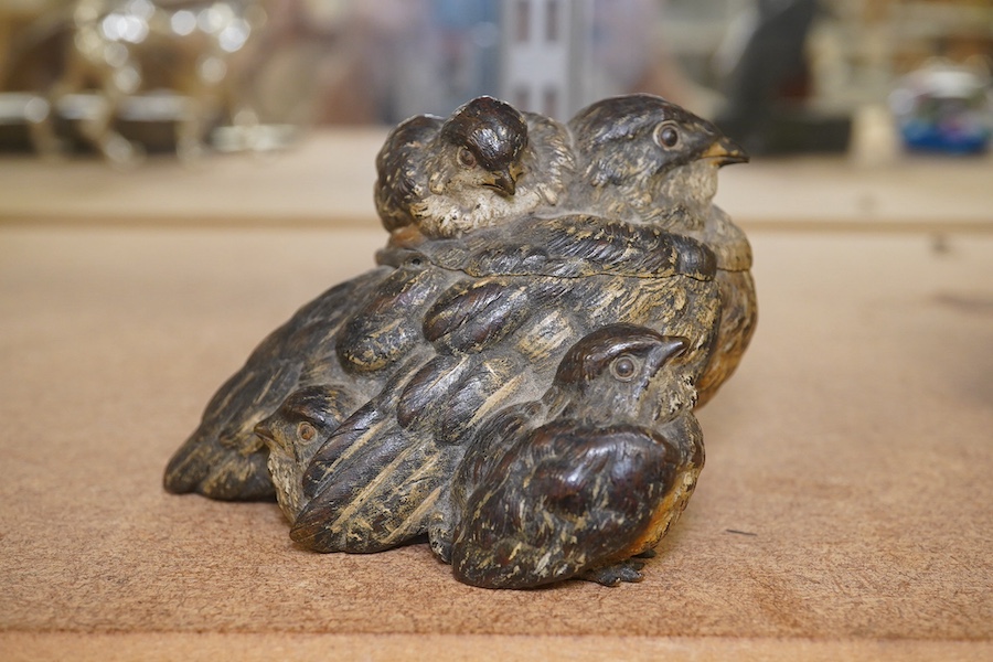 A novelty Austrian cold painted bronze ‘bird and chicks’ inkwell, 10cm wide. Condition - lacking liner, fair to good